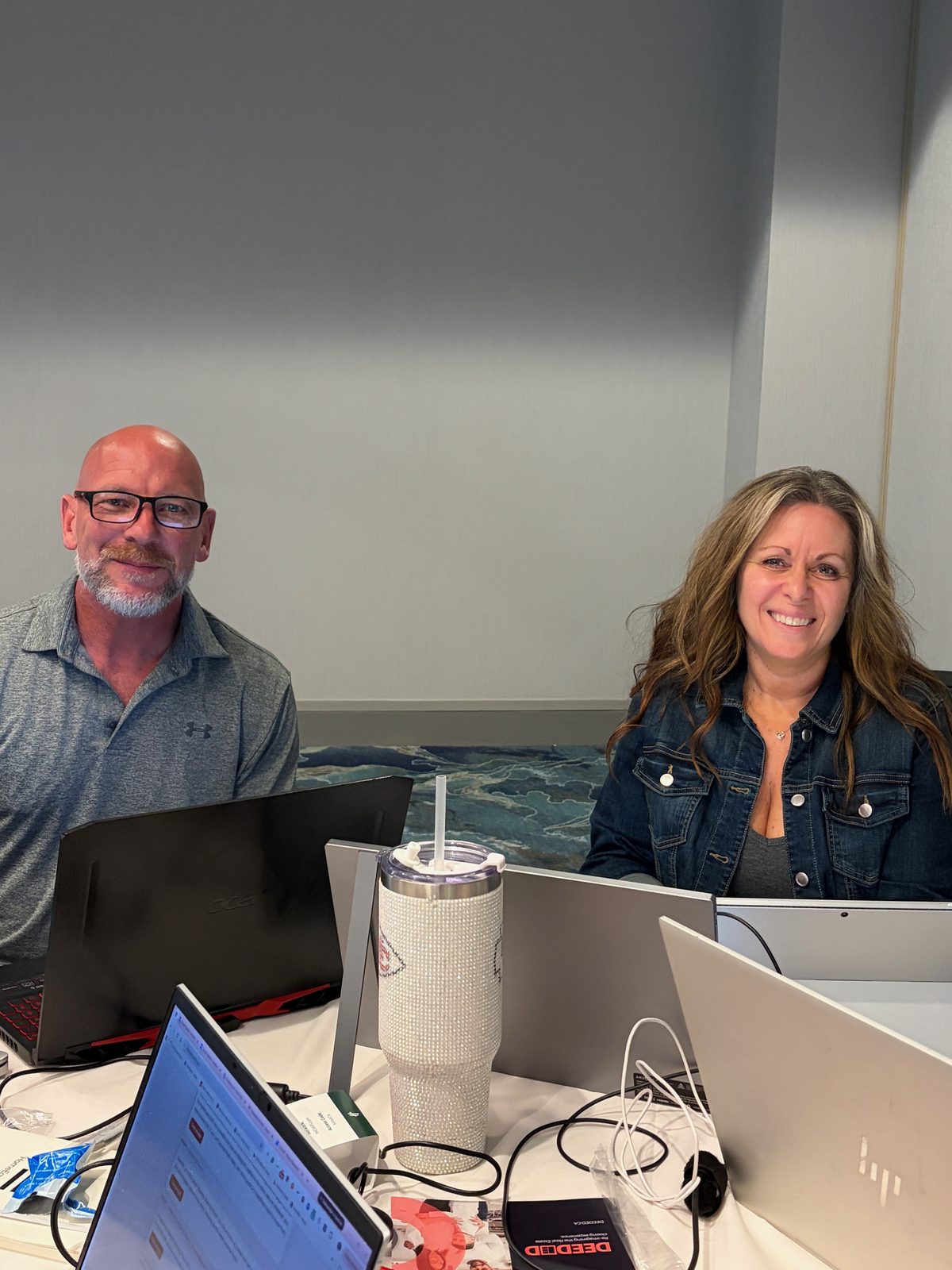 Two brokers smiling during the workshop